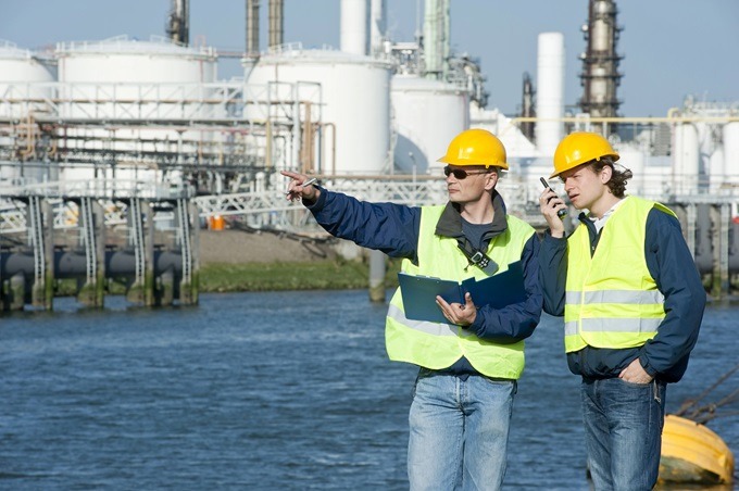 Civil Engineers at a Job Site Pointing at Something